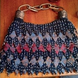 Ipa-Nima Handmade shoulder statement bag, with thick chain strap.